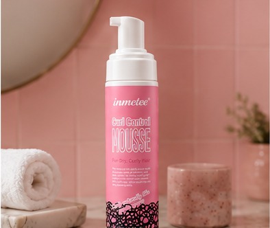 immetee Curl Control Mousse on a bathroom counter
